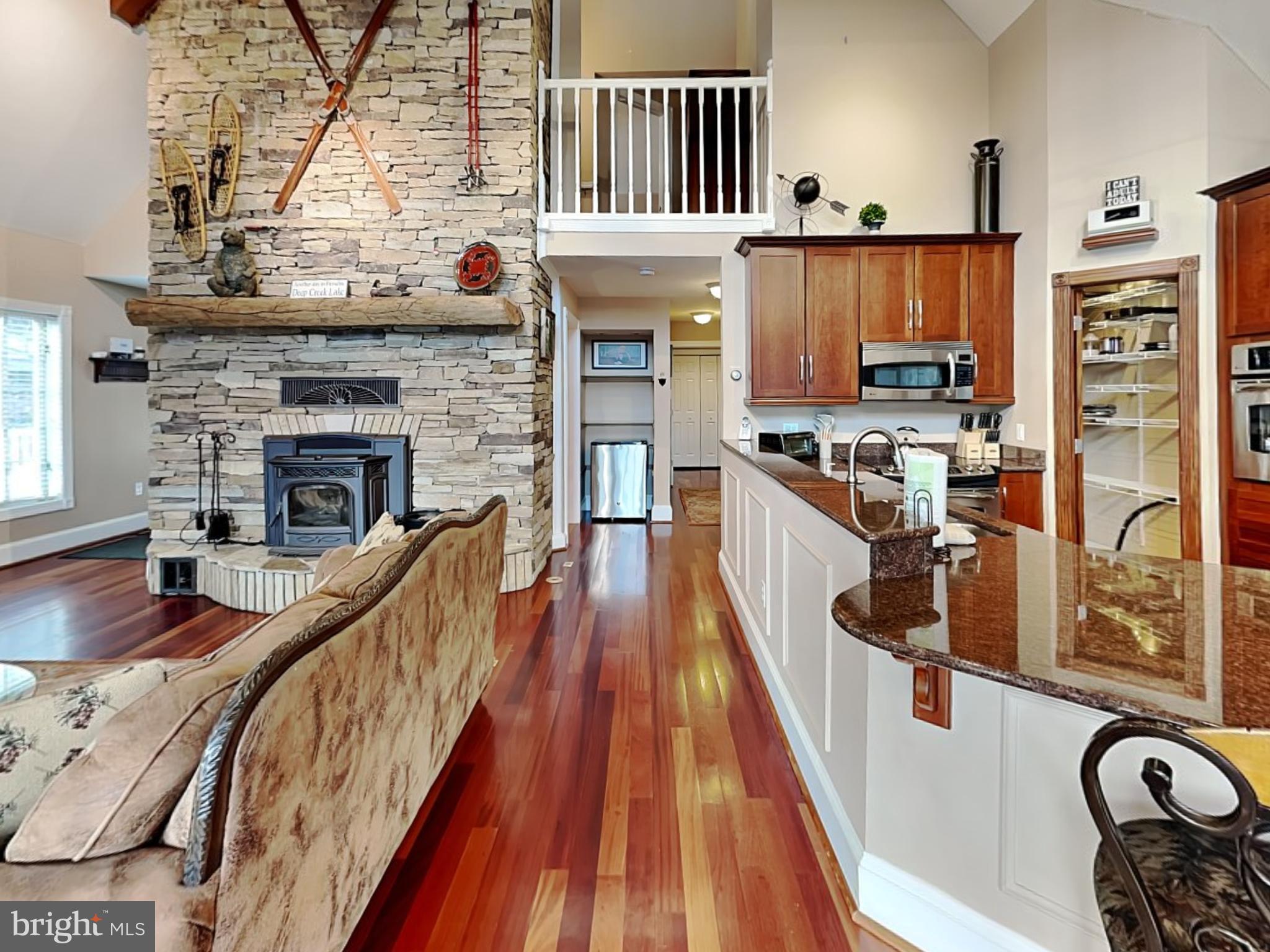 3067 Shingle Camp Road McHenry, MD 21541 - Photo 4 of 68 a view of a kitchen with furniture and a fireplace