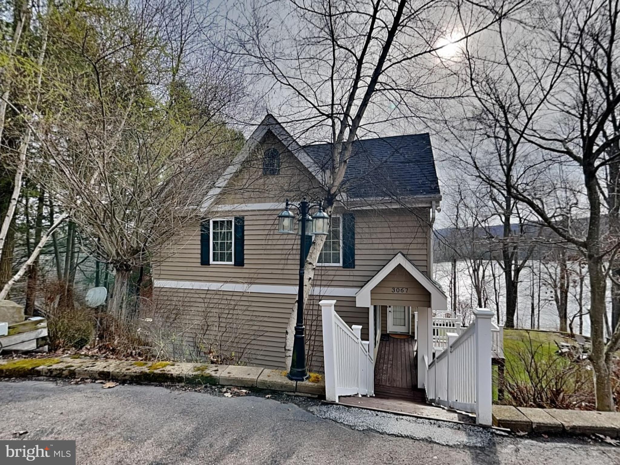 3067 Shingle Camp Road McHenry, MD 21541 - Photo 41 of 68 a front view of a house with a garage