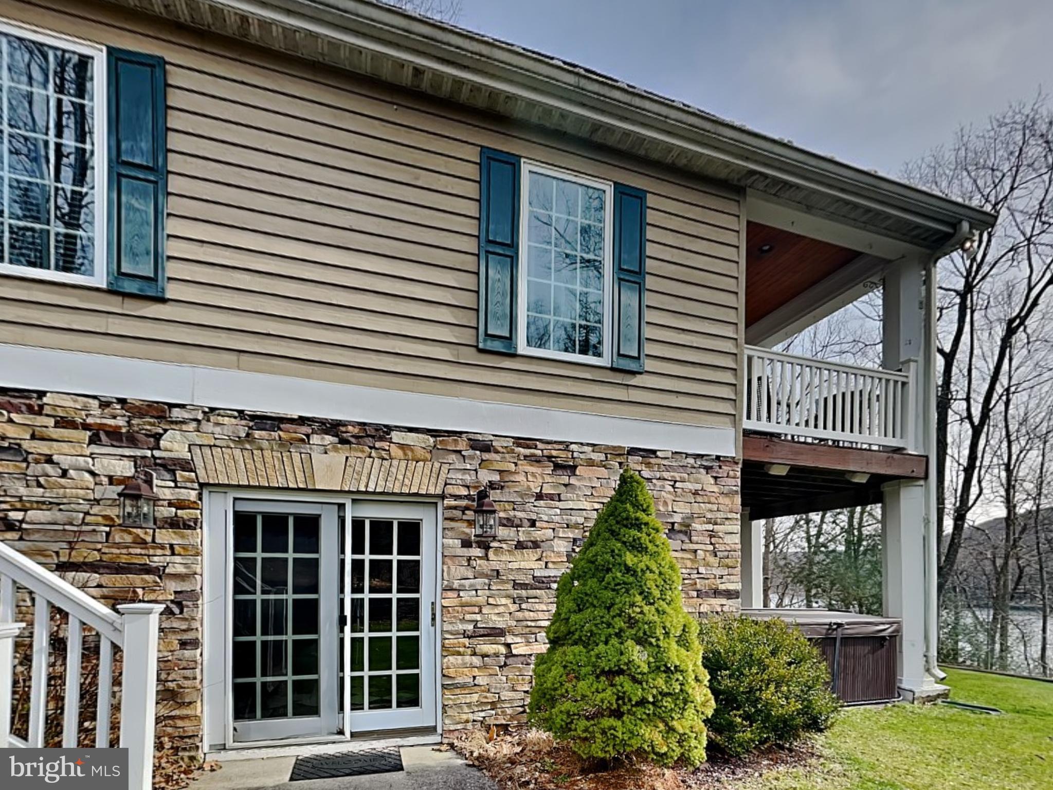 3067 Shingle Camp Road McHenry, MD 21541 - Photo 43 of 68 a front view of a house with a yard