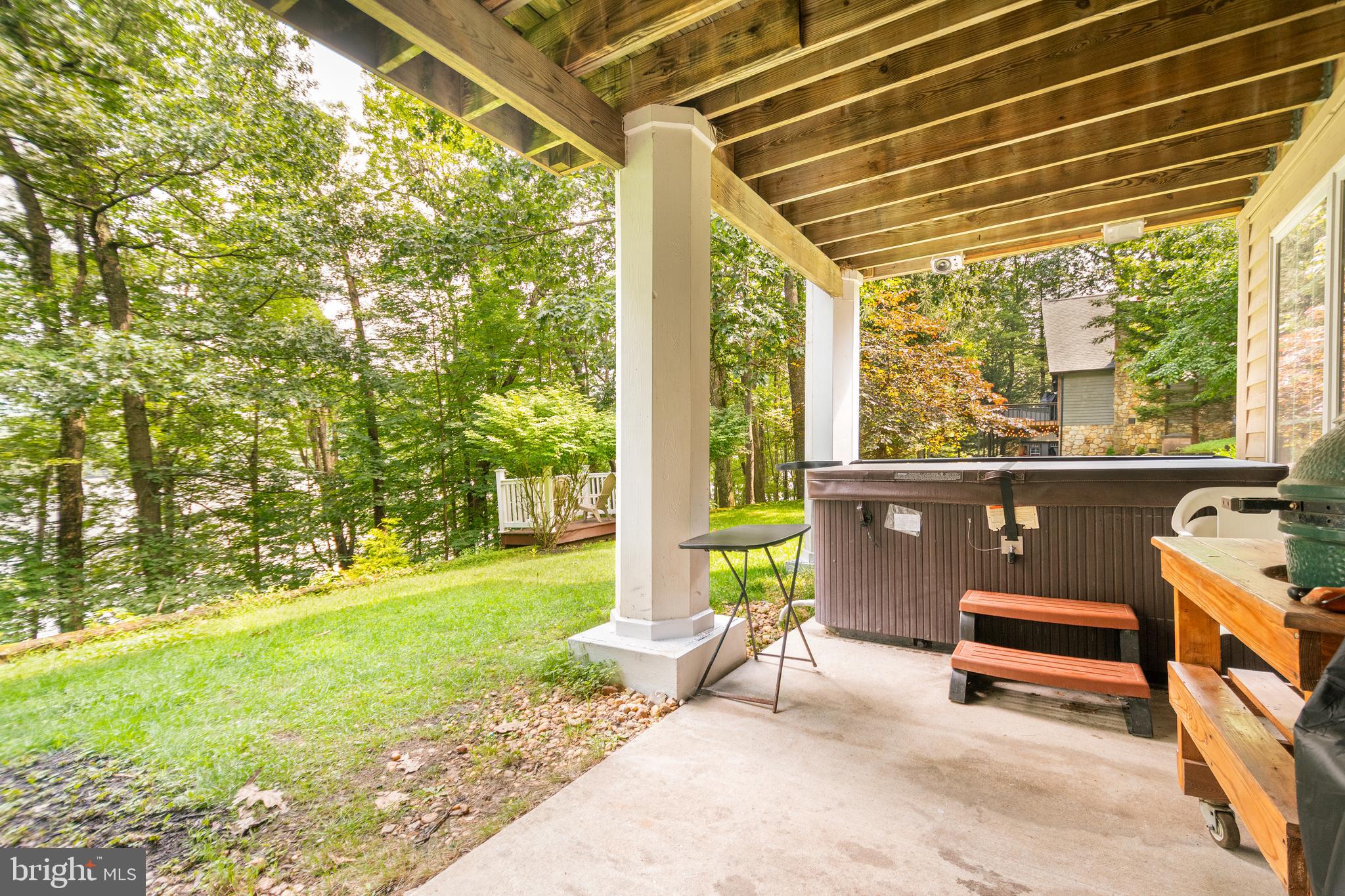 3067 Shingle Camp Road McHenry, MD 21541 - Photo 51 of 68 a view of a patio with a table and chairs