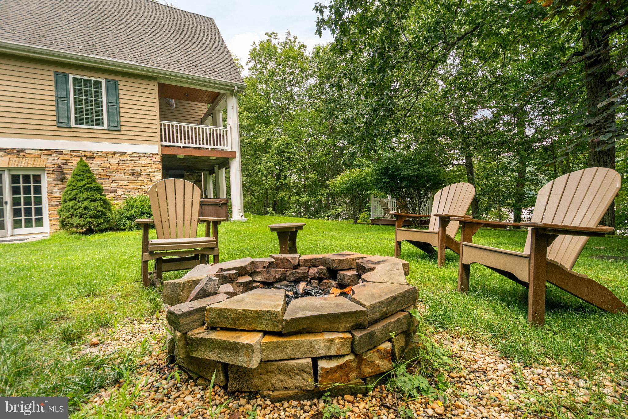 3067 Shingle Camp Road McHenry, MD 21541 - Photo 53 of 68 a backyard of a house with table and chairs
