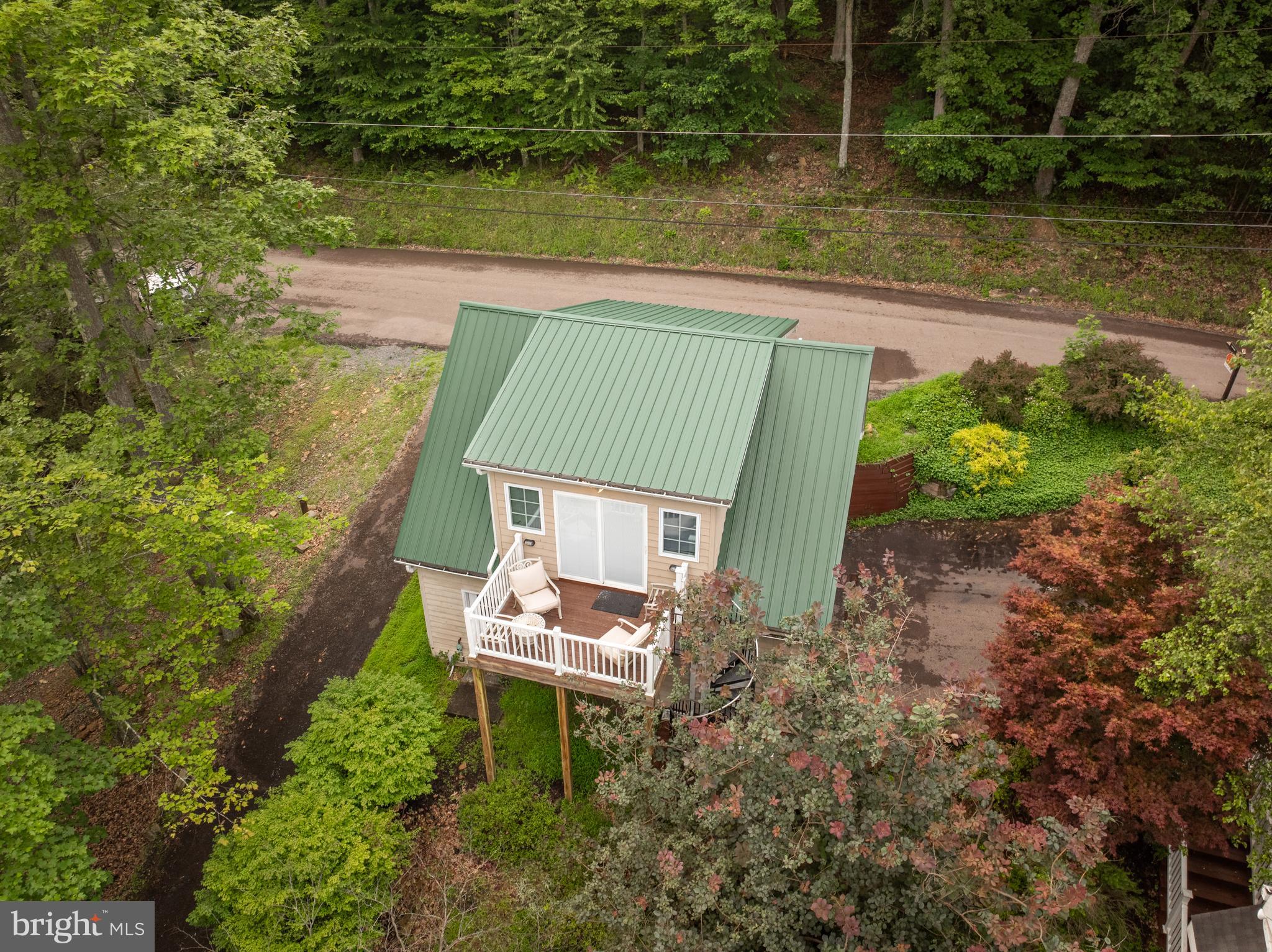 3067 Shingle Camp Road McHenry, MD 21541 - Photo 54 of 68 a backyard of a house with lots of green space and lake view