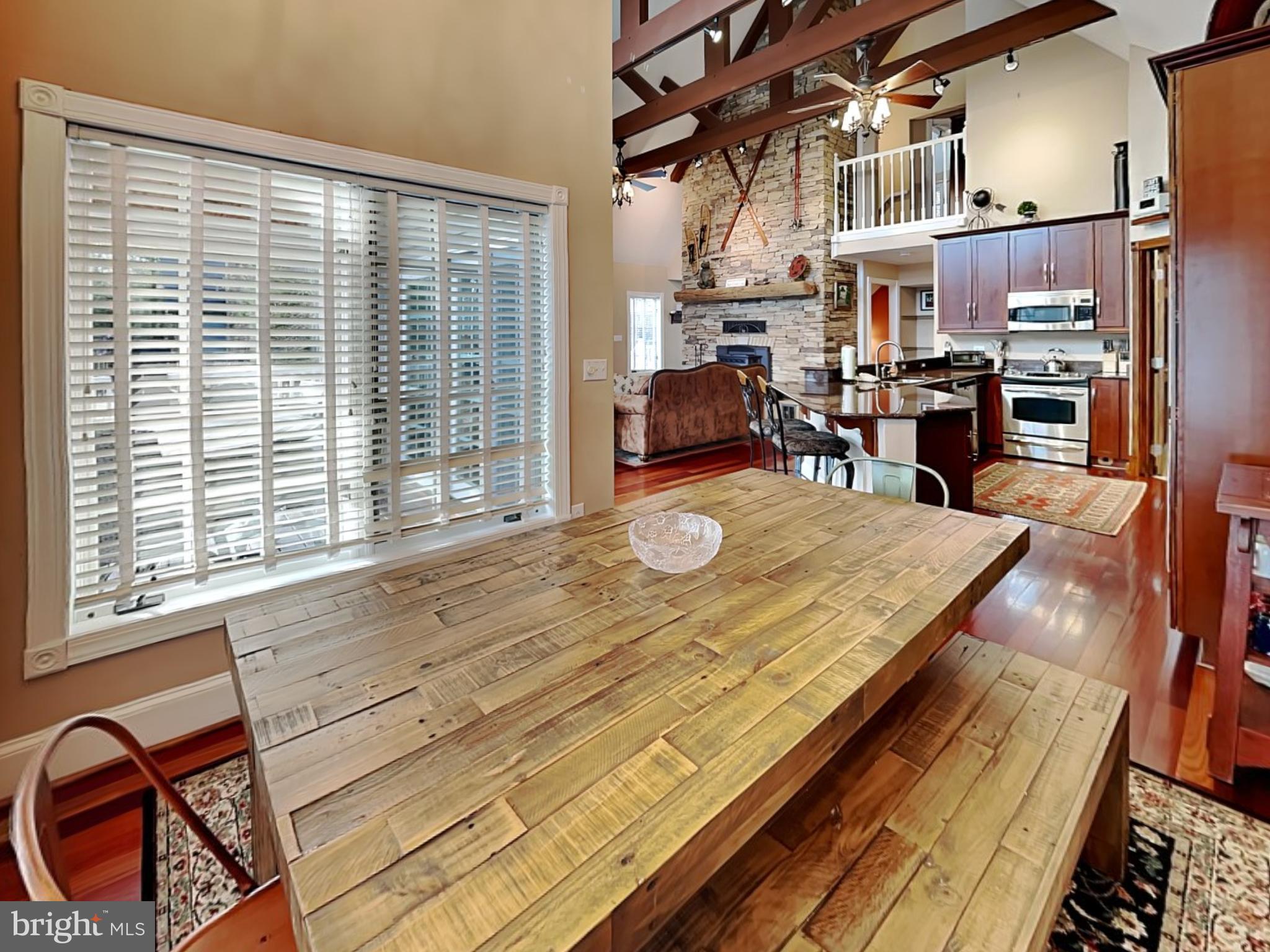 3067 Shingle Camp Road McHenry, MD 21541 - Photo 6 of 68 a room with stainless steel appliances kitchen island granite countertop lots of furniture