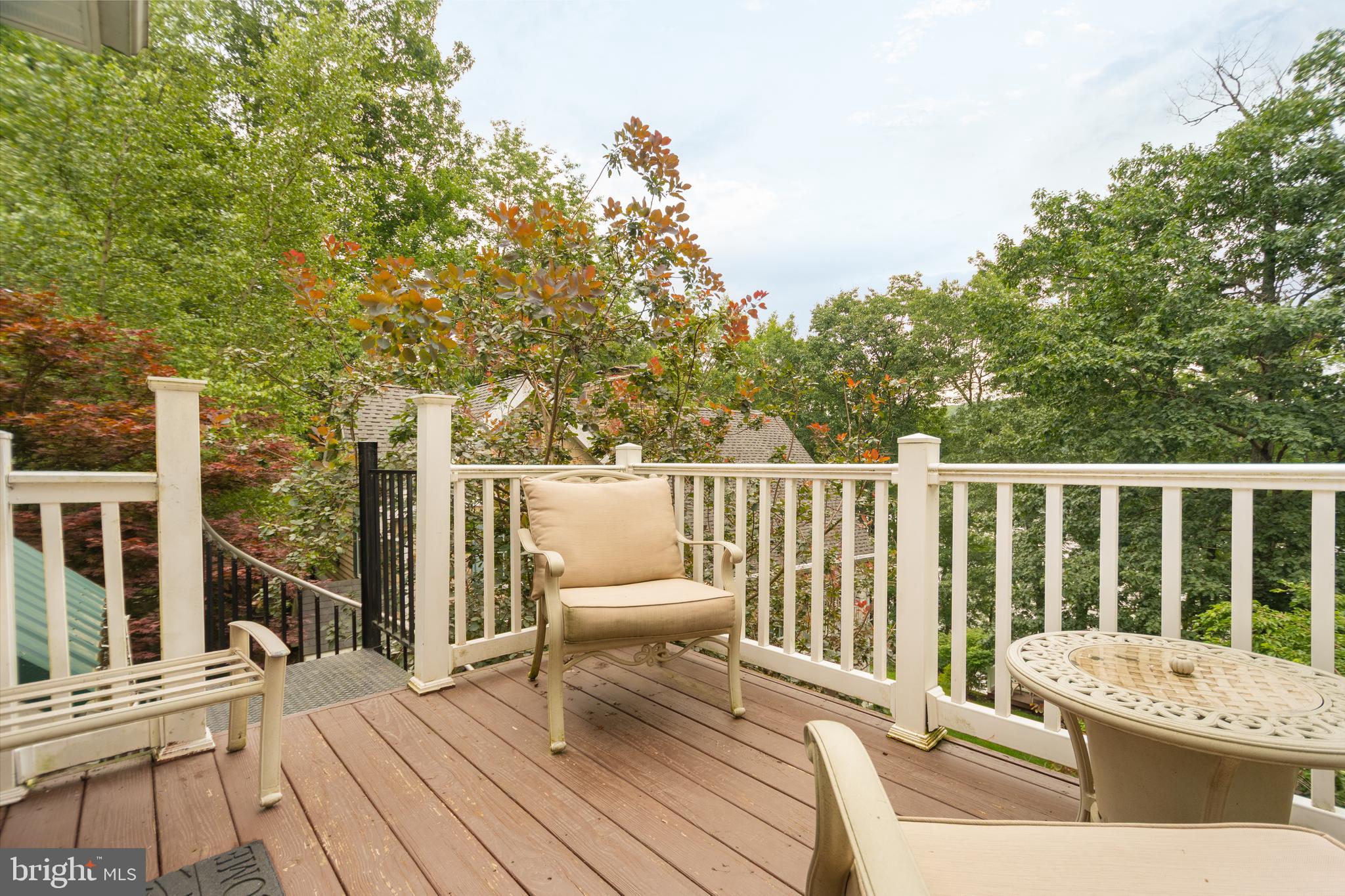 3067 Shingle Camp Road McHenry, MD 21541 - Photo 66 of 68 a balcony with wooden floor table and chairs