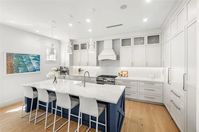 a kitchen with cabinets and appliances