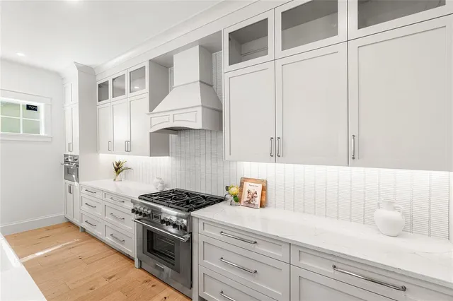 a kitchen with sink a counter and chairs