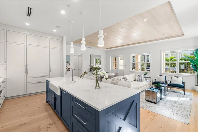 a kitchen with counter top space a sink stainless steel appliances and cabinets