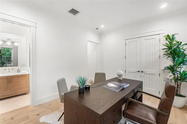 a bathroom with a granite countertop sink a toilet and a mirror