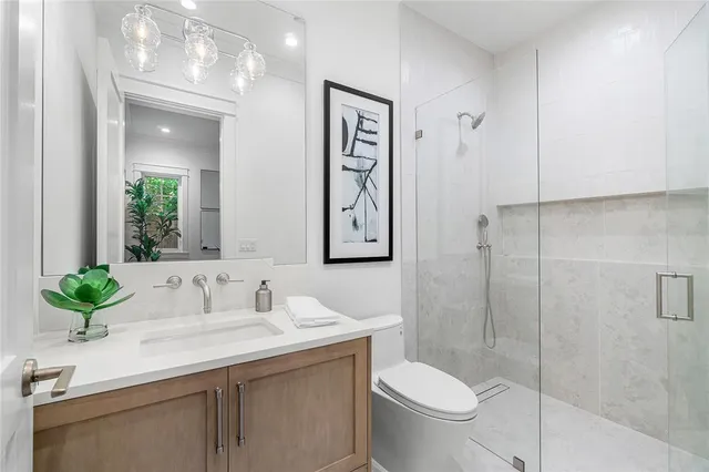 a view of staircase with railing and white walls