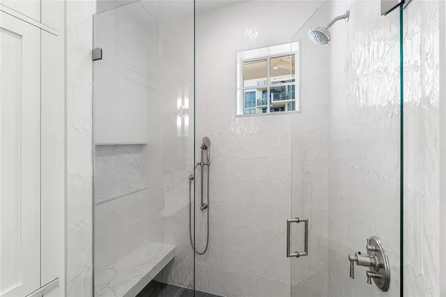 a bathroom with double sink and a mirror