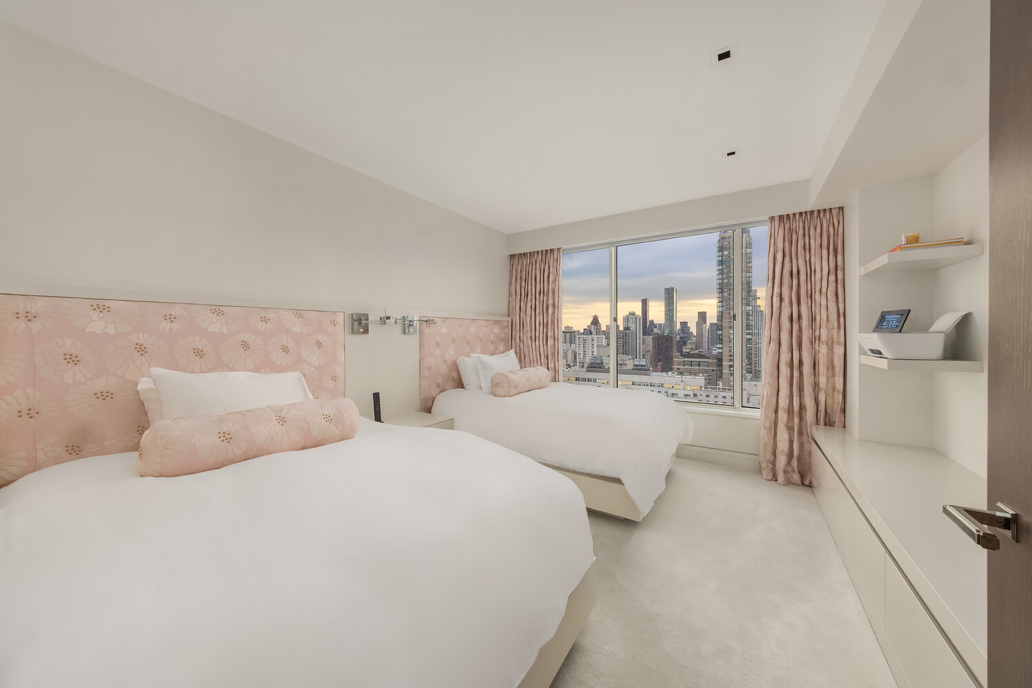 200 East 69th Street, Unit 31C Manhattan, NY 10021 - Photo 13 of 19 a bed room with two twin beds in it