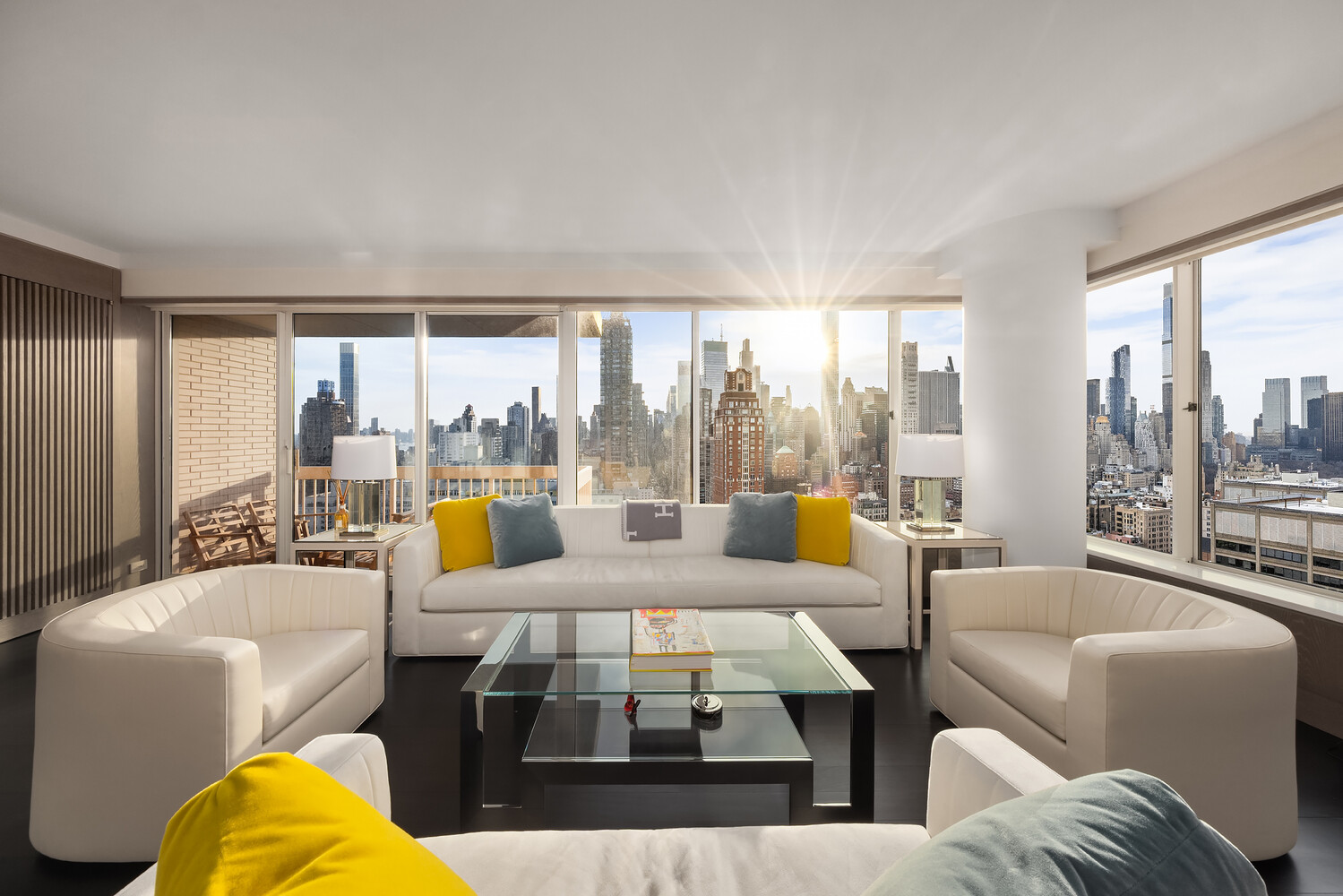 200 East 69th Street, Unit 31C Manhattan, NY 10021 - Photo 2 of 19 a living room with furniture and a large window