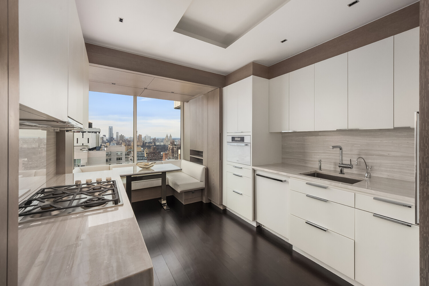 200 East 69th Street, Unit 31C Manhattan, NY 10021 - Photo 7 of 19 a kitchen with sink refrigerator and cabinets