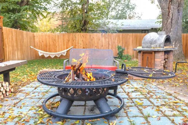 a view of a swimming pool with a chairs in a patio