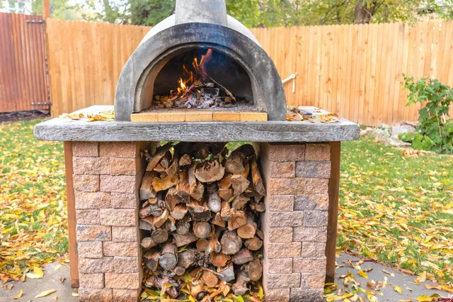 a view of fireplace with a sink and wooden floor