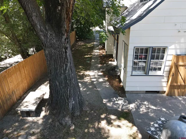 a view of a house with a tree