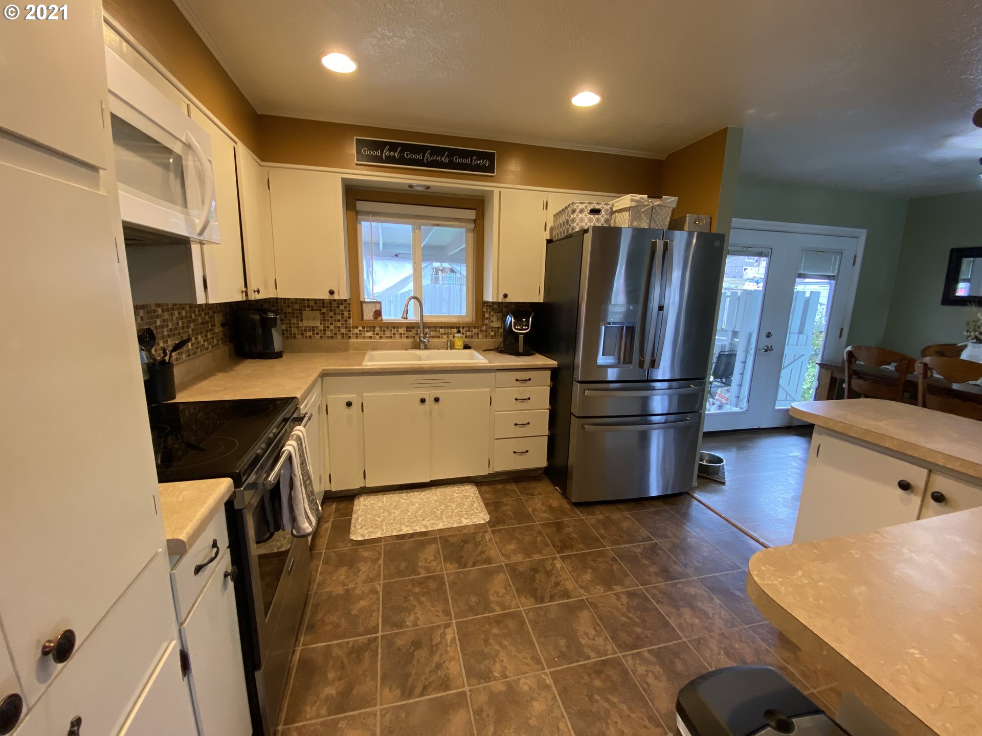 3216 Southwest Jay Avenue Pendleton, OR 97801 - Photo 14 of 32 a kitchen with stainless steel appliances granite countertop a sink refrigerator and cabinets