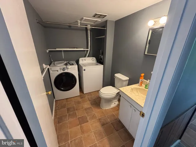 a bathroom with a toilet and a sink