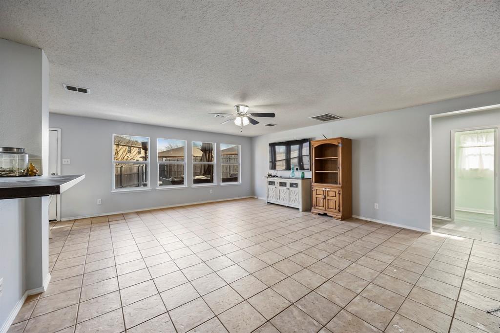 1609 Jester Court Little Elm, TX 75036 - Photo 11 of 34 a view of an empty room with window and cabinet