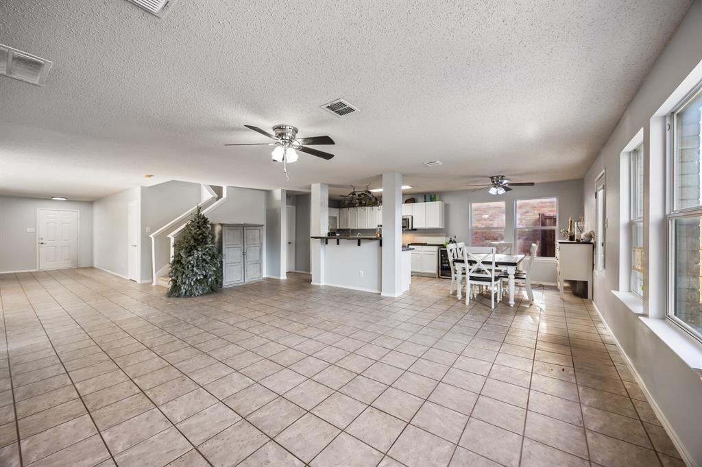 1609 Jester Court Little Elm, TX 75036 - Photo 13 of 34 a view of a livingroom with furniture and a ceiling fan