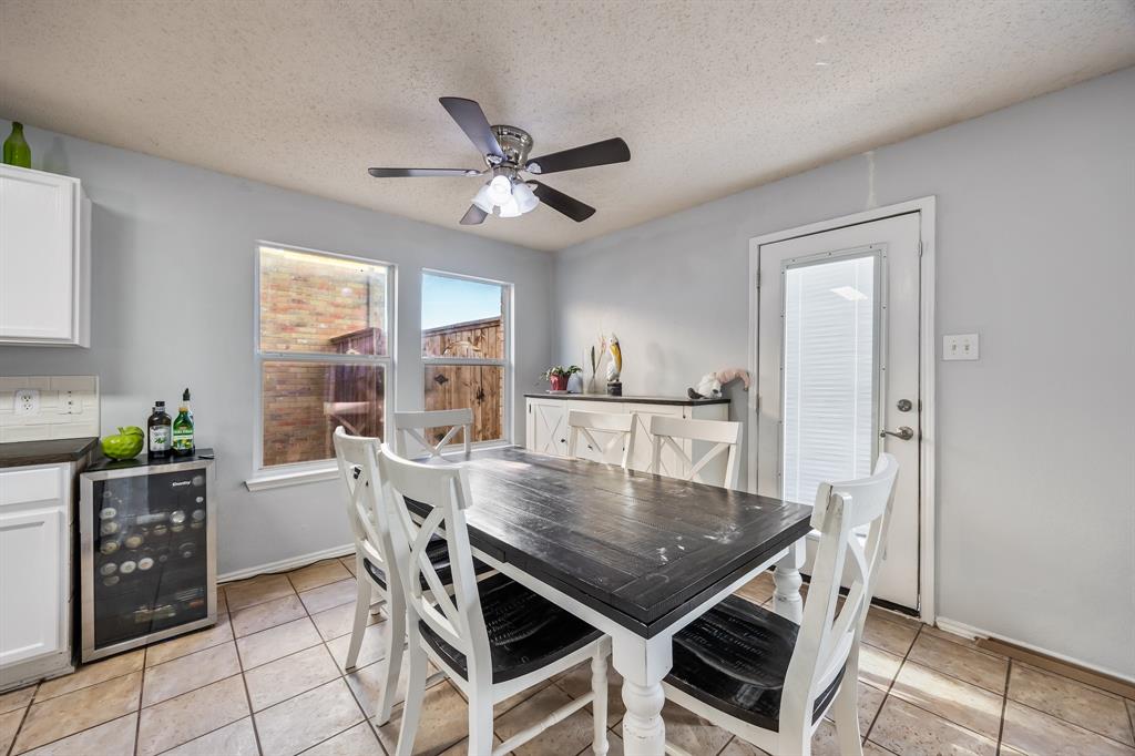 1609 Jester Court Little Elm, TX 75036 - Photo 14 of 34 a view of a dining room with furniture and window