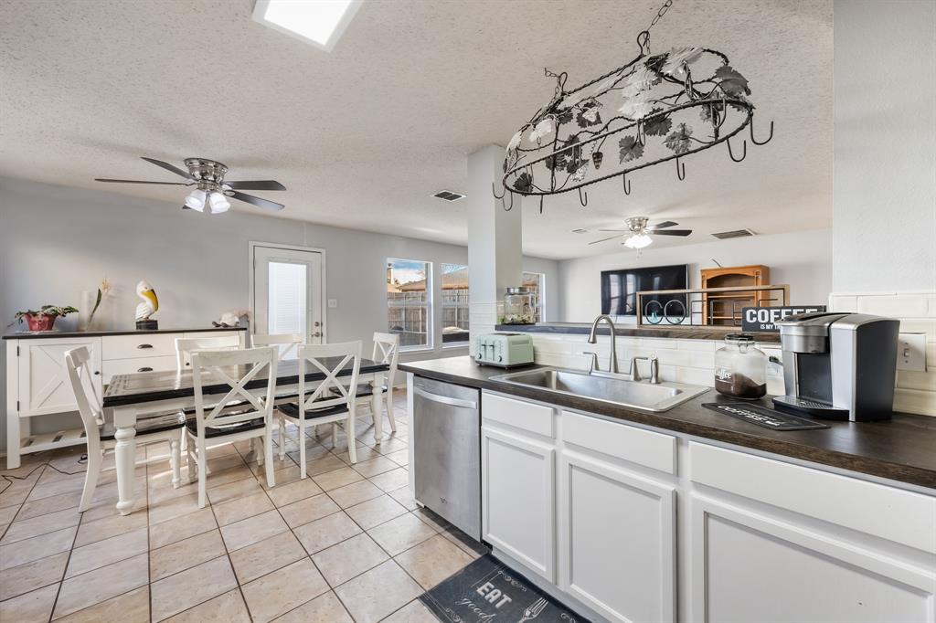 1609 Jester Court Little Elm, TX 75036 - Photo 18 of 34 a kitchen with a sink and cabinets