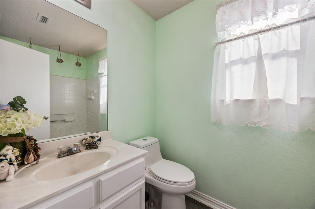 1609 Jester Court Little Elm, TX 75036 - Photo 19 of 34 a bathroom with a sink and a toilet