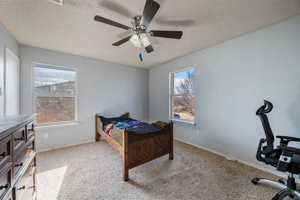 1609 Jester Court Little Elm, TX 75036 - Photo 22 of 34 a room with furniture and window