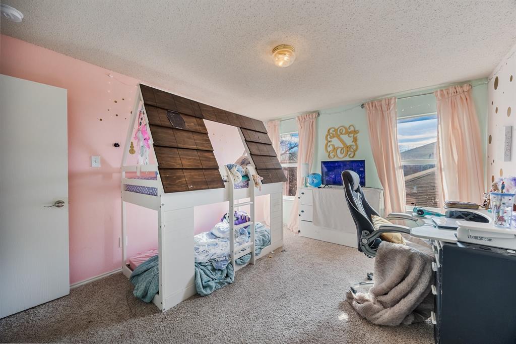 1609 Jester Court Little Elm, TX 75036 - Photo 24 of 34 a room with gym equipment and a window