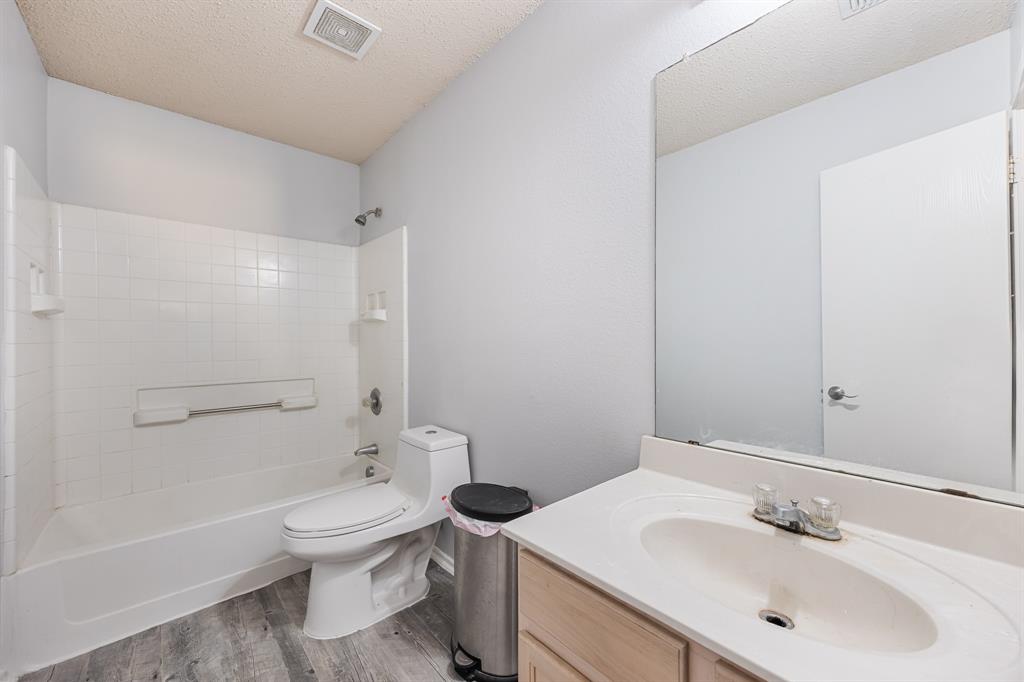1609 Jester Court Little Elm, TX 75036 - Photo 29 of 34 a bathroom with a sink toilet and shower