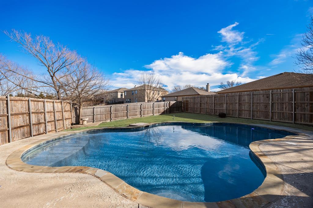 1609 Jester Court Little Elm, TX 75036 - Photo 31 of 34 a view of a swimming pool with a patio