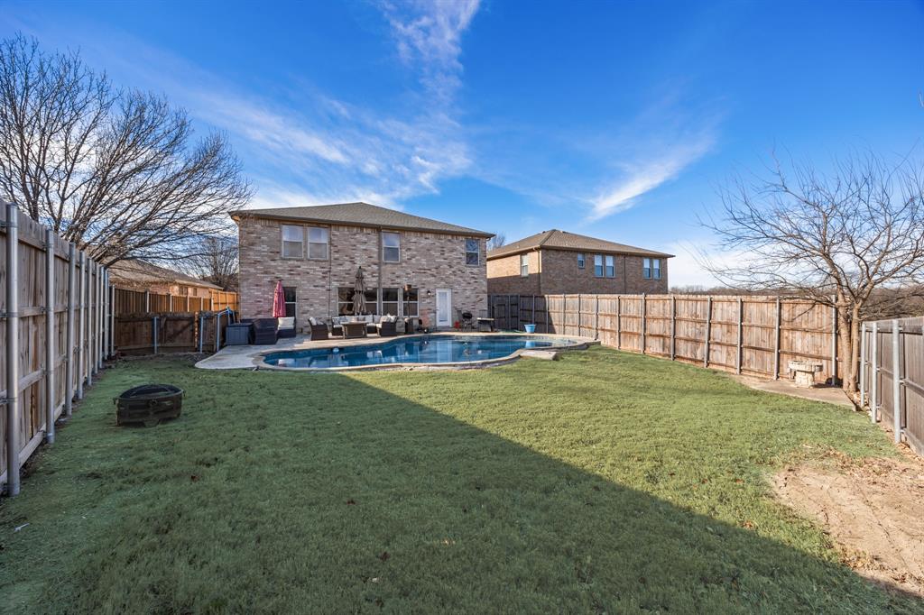 1609 Jester Court Little Elm, TX 75036 - Photo 32 of 34 a view of a yard in front of a house