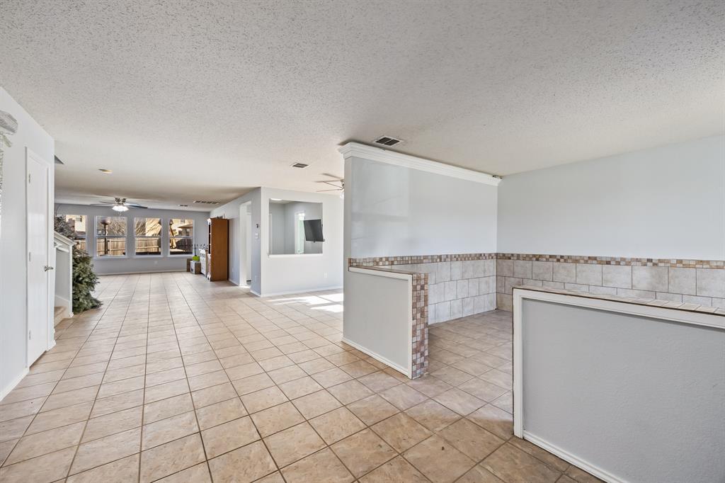 1609 Jester Court Little Elm, TX 75036 - Photo 8 of 34 a view of a kitchen with furniture and a kitchen