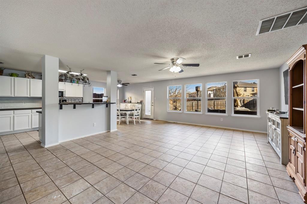 1609 Jester Court Little Elm, TX 75036 - Photo 10 of 34 a view of kitchen with furniture and refrigerator