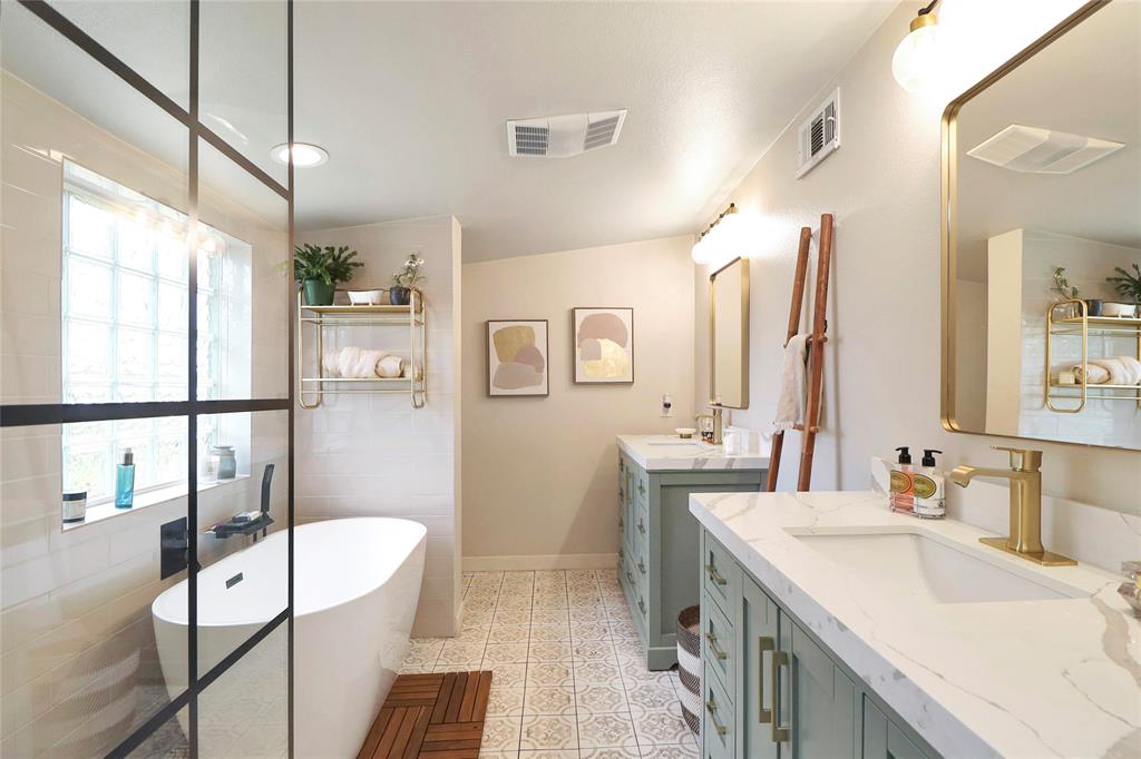 2408 Strader Road DISH, TX 76247 - Photo 18 of 40 a bathroom with a tub sink and mirror