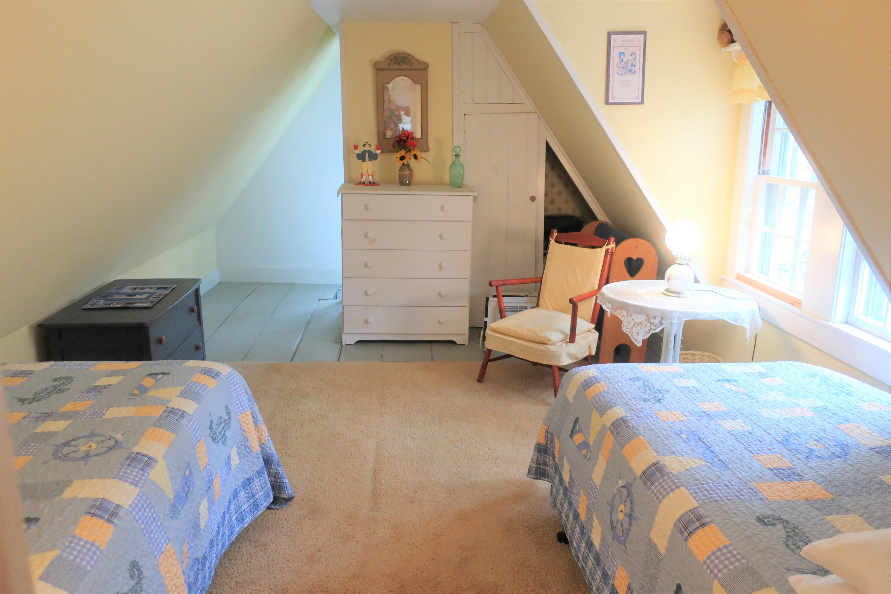 5 Meetinghouse Road Truro, MA 02666 - Photo 33 of 40 a bedroom with two beds and painted walls