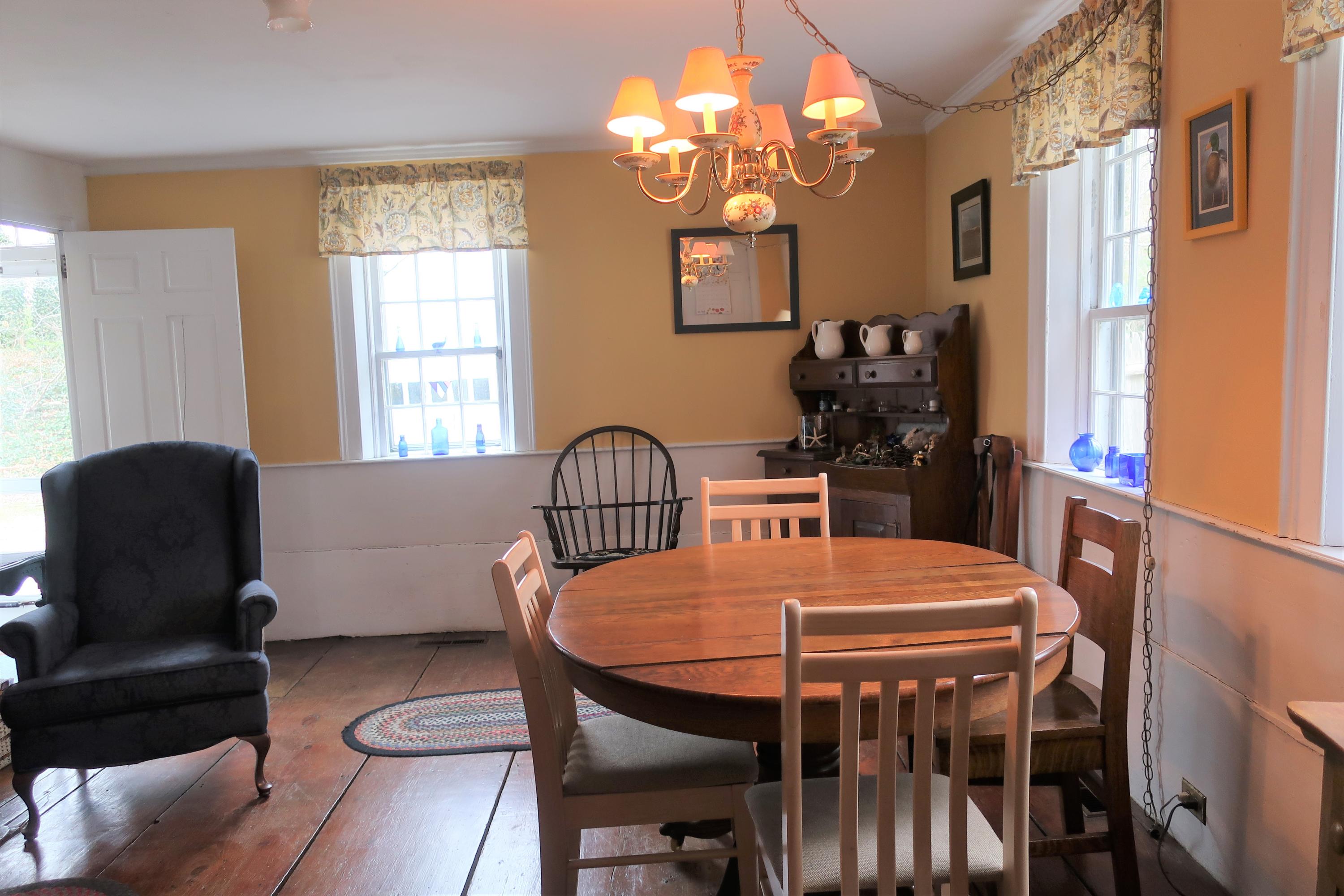 5 Meetinghouse Road Truro, MA 02666 - Photo 10 of 40 a view of a dining room with furniture window and outside view