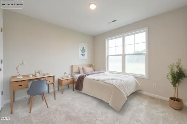 a bedroom with a bed and a table