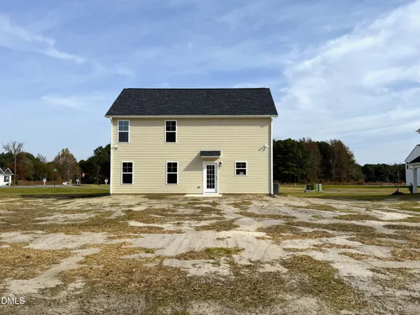a house with trees in the background