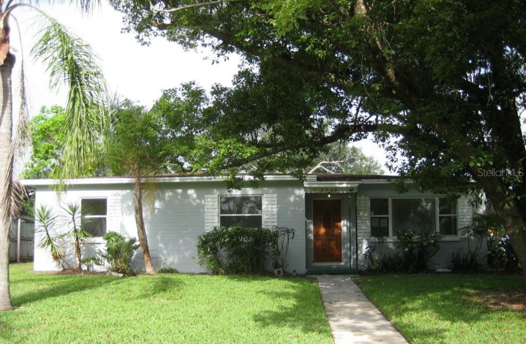 2700 Zephyr Road Orlando, FL 32806 - Photo 1 of 1 a front view of a house with a yard and porch