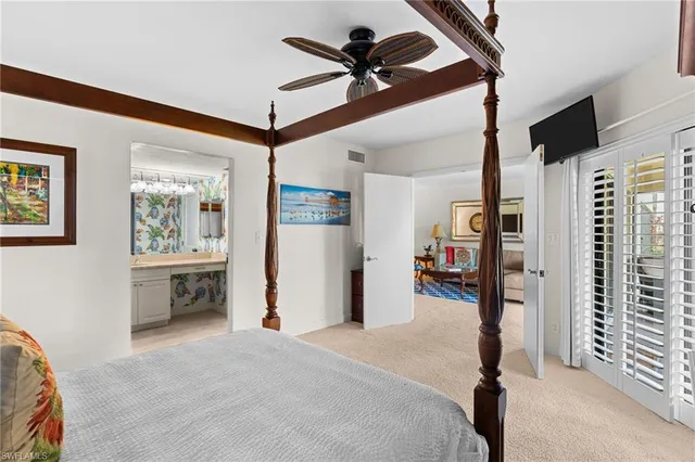 a bedroom with furniture and window