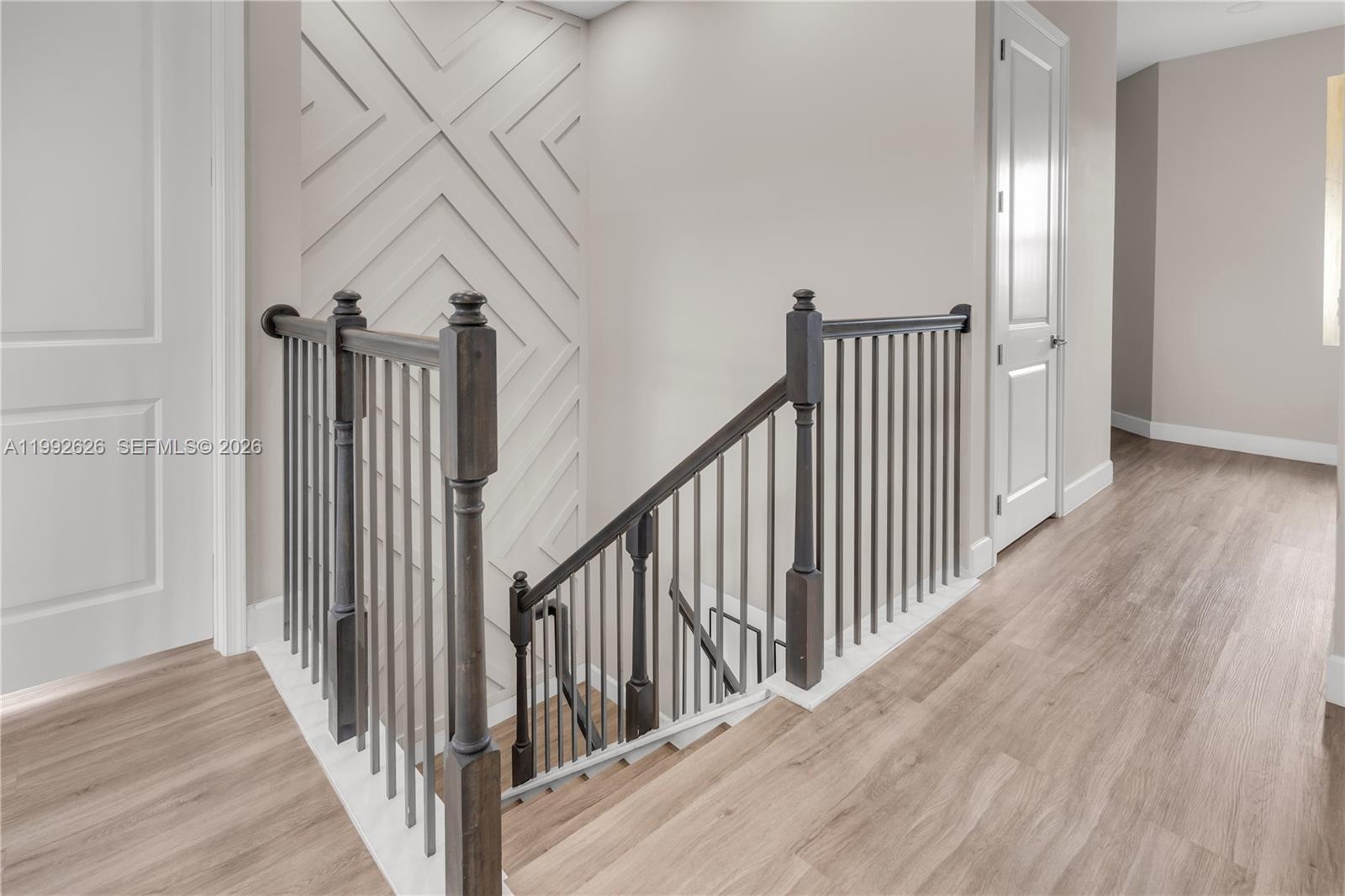 15769 Hummingbird Lane Loxahatchee, FL 33470 - Photo 19 of 54 a view of a hallway with wooden floor and entryway