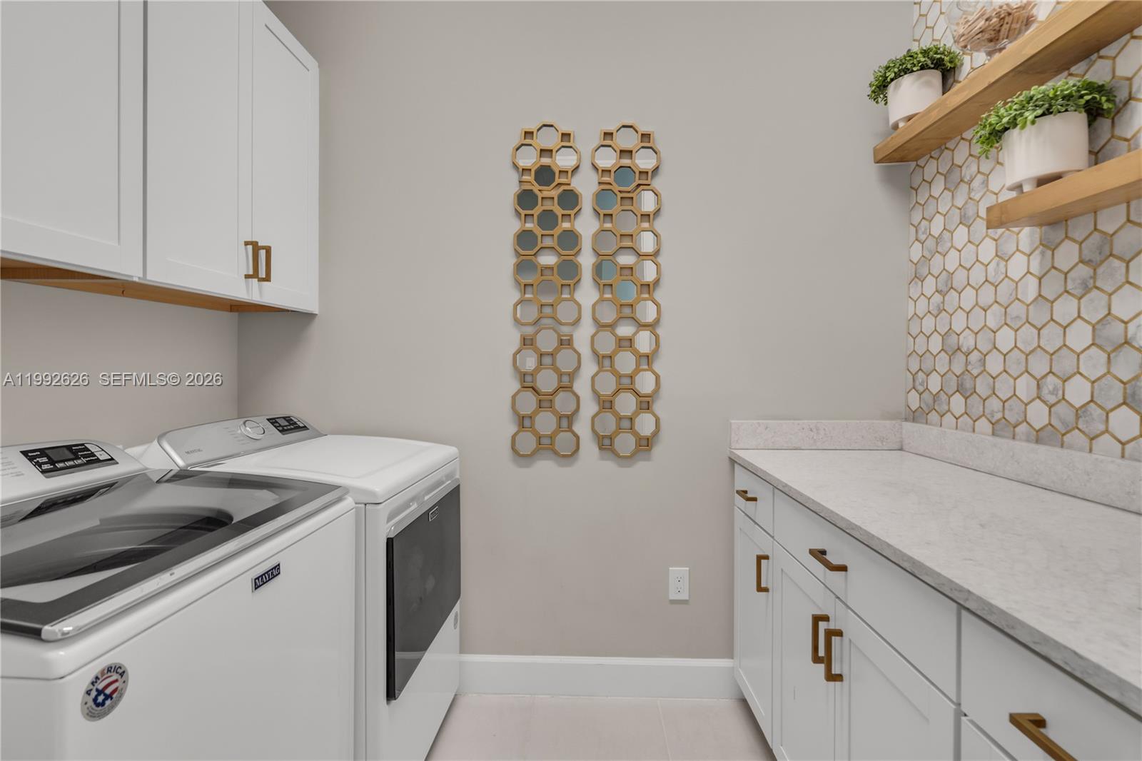 15769 Hummingbird Lane Loxahatchee, FL 33470 - Photo 30 of 54 a utility room with dryer and washer