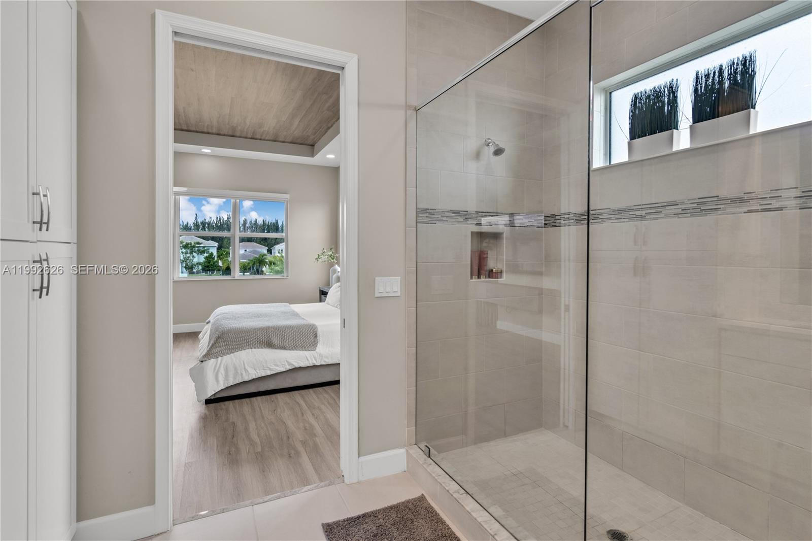 15769 Hummingbird Lane Loxahatchee, FL 33470 - Photo 36 of 54 a en suite bathroom with a shower