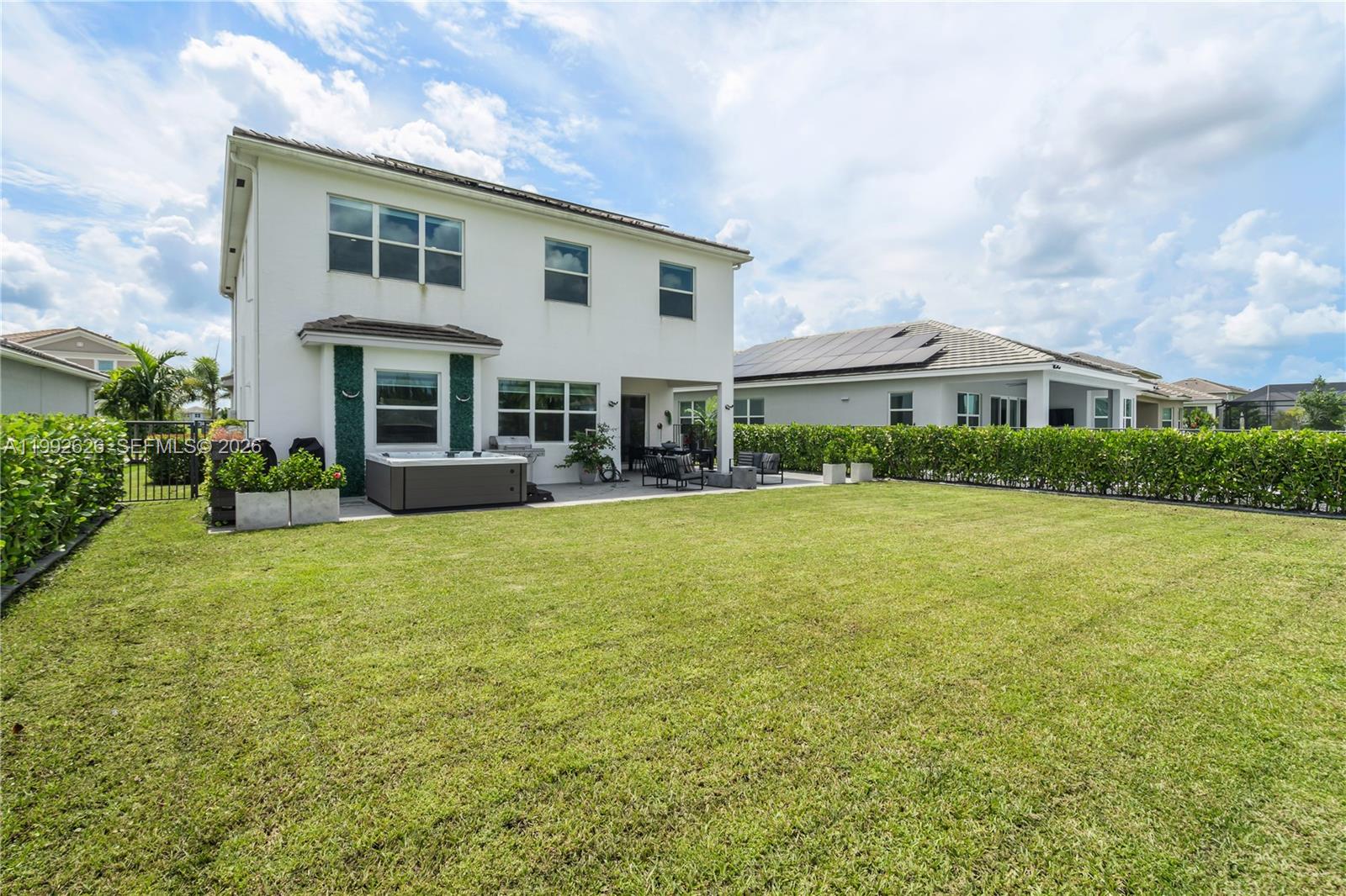 15769 Hummingbird Lane Loxahatchee, FL 33470 - Photo 41 of 54 a front view of house with yard and green space
