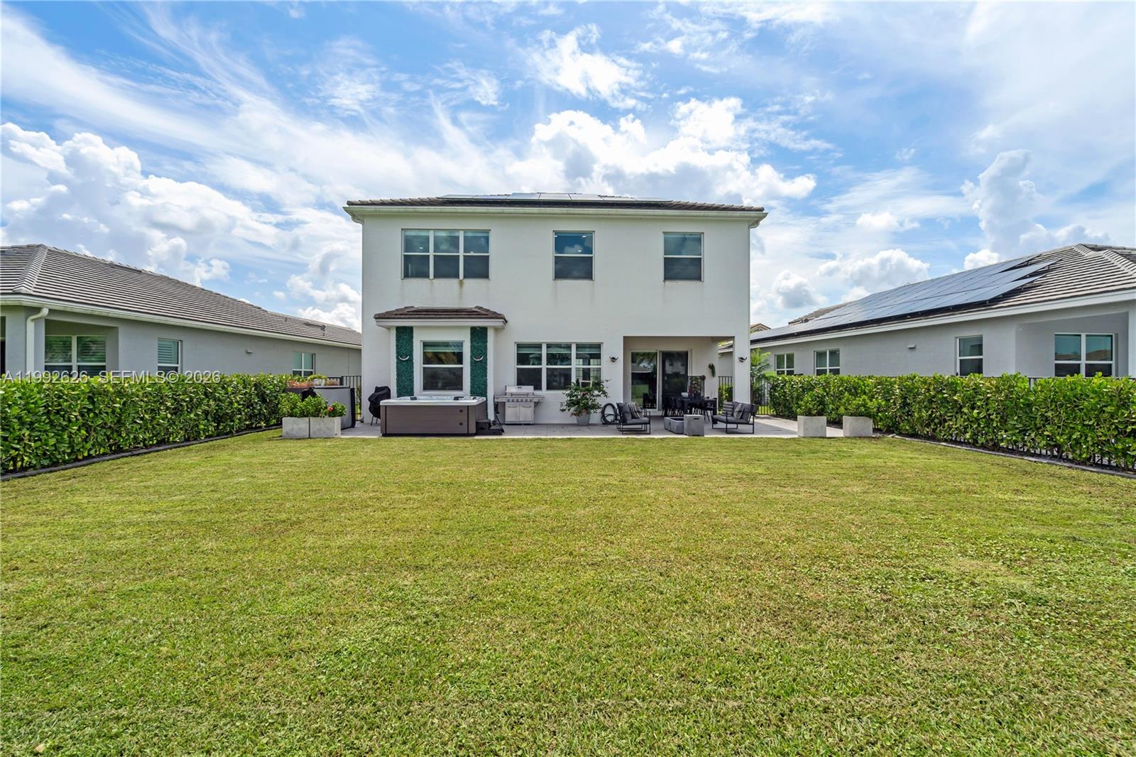 15769 Hummingbird Lane Loxahatchee, FL 33470 - Photo 43 of 54 a front view of house with yard and swimming pool