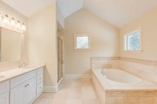 a bathroom with a bathtub and a sink