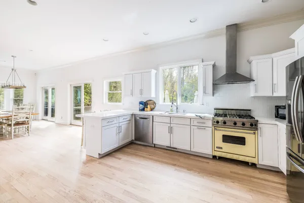 a kitchen with a stove a sink and a refrigerator