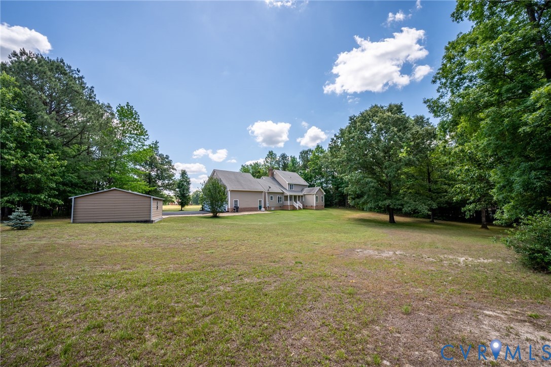 17170 Templeton Road Disputanta, VA 23842 - Photo 27 of 27 a view of a house with a big yard and basketball court