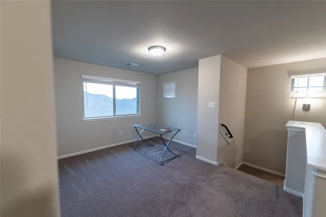 a workspace room with windows